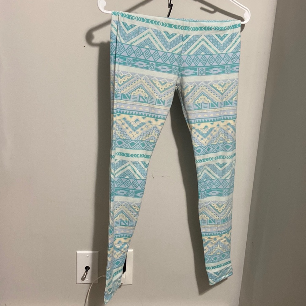 Teal pattern leggings. One size